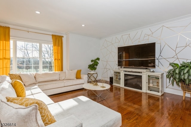 living room featuring a fireplace, dark wood-type flooring, and ornamental molding