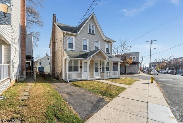 view of front of property featuring covered porch