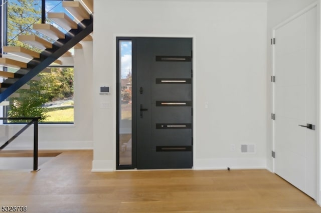 foyer entrance featuring hardwood / wood-style floors