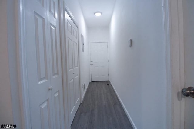 hallway featuring dark hardwood / wood-style floors