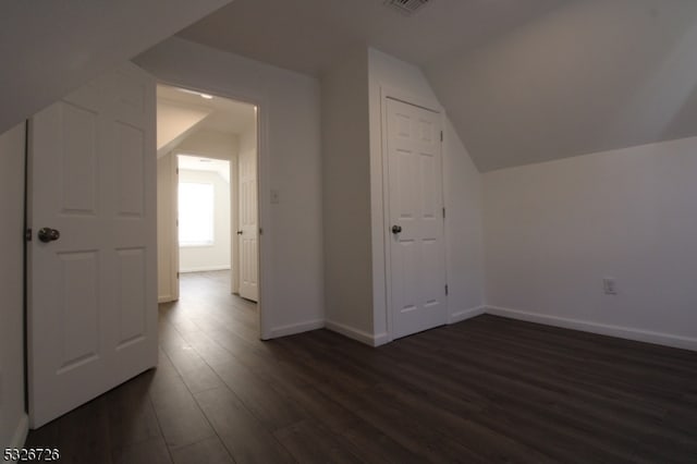 bonus room featuring dark hardwood / wood-style flooring and lofted ceiling