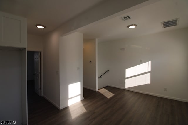 unfurnished room featuring dark hardwood / wood-style flooring