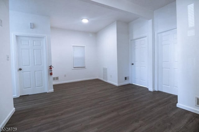 interior space with dark hardwood / wood-style flooring