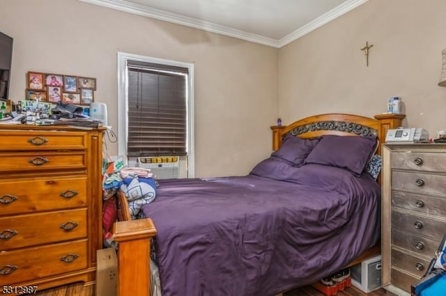 bedroom with wood-type flooring, cooling unit, and crown molding