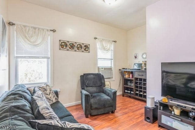 living room with hardwood / wood-style floors and cooling unit