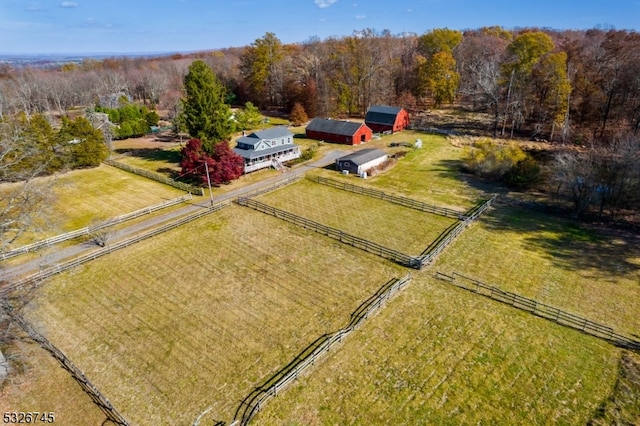 birds eye view of property with a rural view