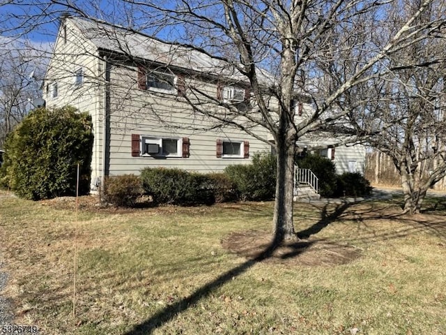 view of home's exterior featuring a lawn