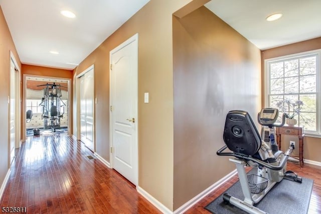 exercise area with wood-type flooring