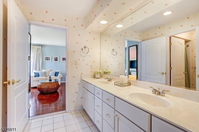 bathroom with hardwood / wood-style floors and vanity