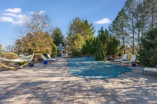 view of pool with a gazebo and a patio