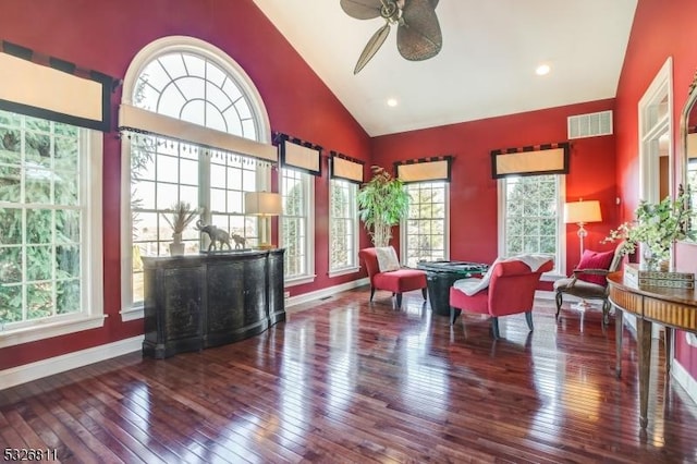 interior space with hardwood / wood-style floors, ceiling fan, and high vaulted ceiling