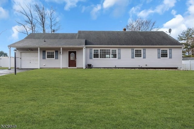 ranch-style home featuring a front yard and a garage