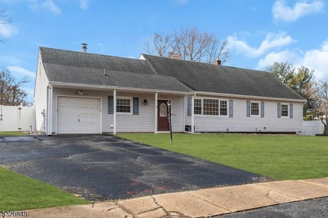 ranch-style house with a garage and a front yard