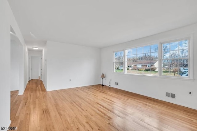 spare room featuring light hardwood / wood-style flooring