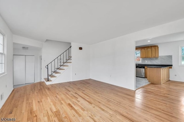 unfurnished living room featuring light wood-type flooring