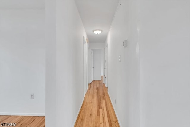 hallway featuring light hardwood / wood-style floors