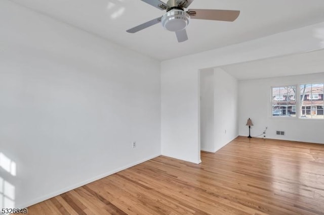 spare room with light hardwood / wood-style floors and ceiling fan