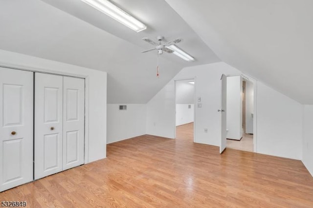 bonus room featuring vaulted ceiling, light hardwood / wood-style flooring, and ceiling fan