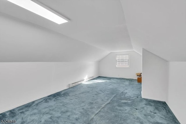 bonus room with a baseboard radiator, vaulted ceiling, and dark carpet