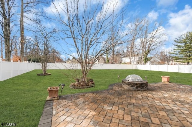 view of patio featuring an outdoor fire pit