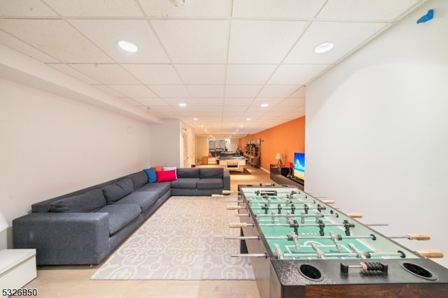 recreation room featuring a paneled ceiling