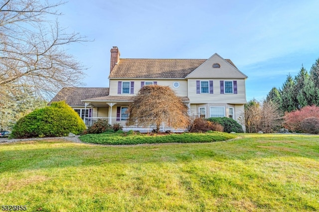 colonial home with a front yard