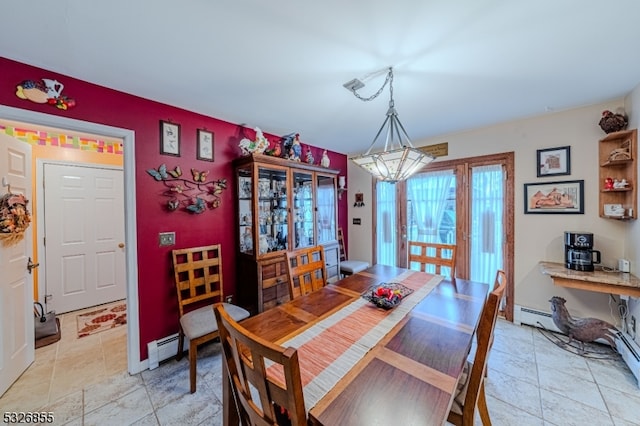 dining room with baseboard heating and a chandelier