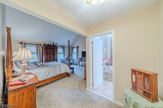 carpeted bedroom with lofted ceiling