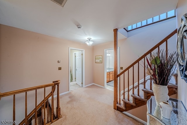 foyer with light colored carpet