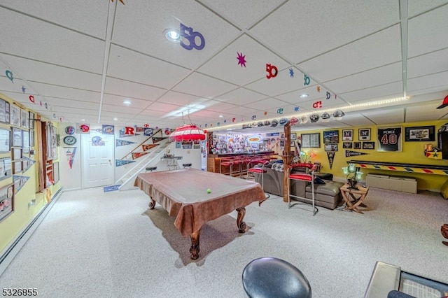 recreation room featuring a paneled ceiling, carpet floors, a baseboard radiator, and pool table