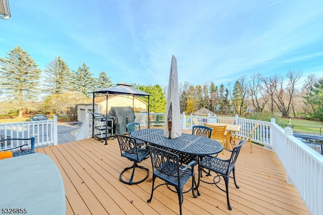 deck featuring a gazebo and a grill