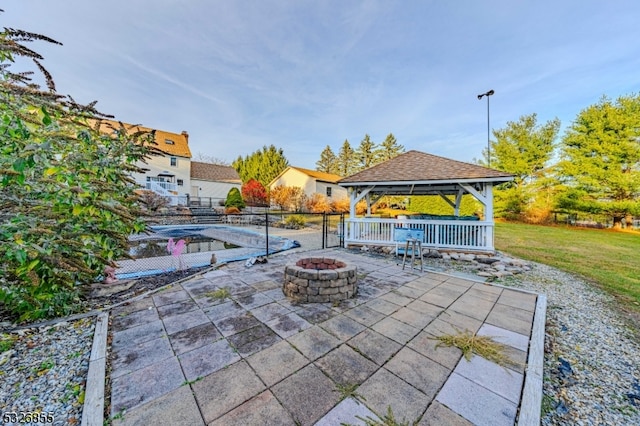 view of patio with a gazebo and a fire pit