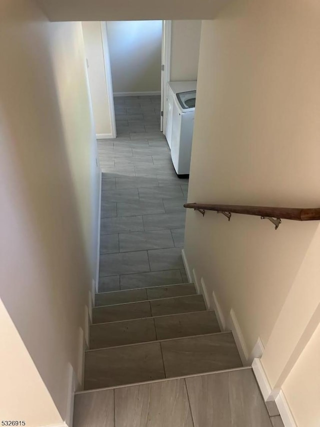 staircase featuring washer / clothes dryer