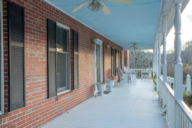 deck featuring a porch and ceiling fan