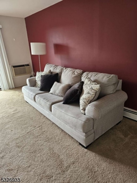 carpeted living room with a wall mounted air conditioner