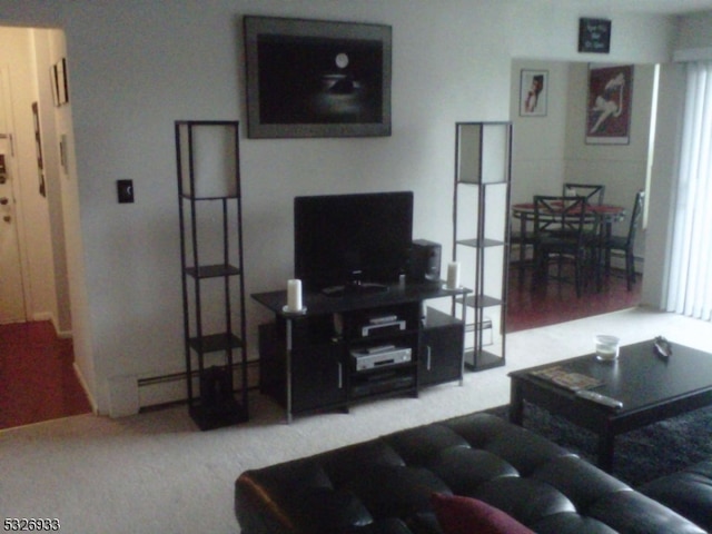 living room featuring hardwood / wood-style flooring and baseboard heating