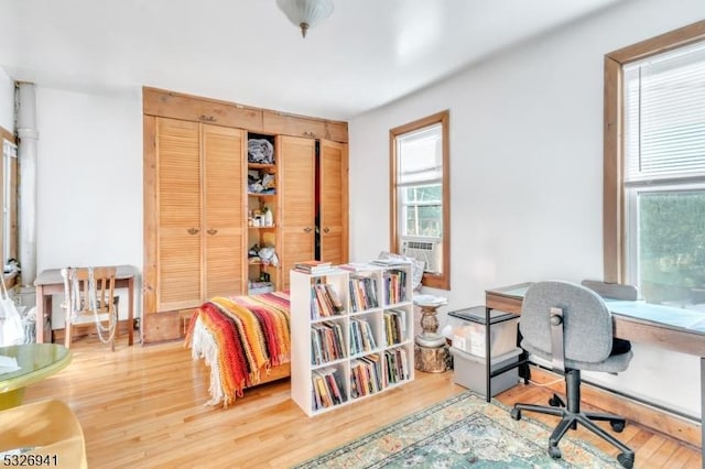 home office with wood-type flooring