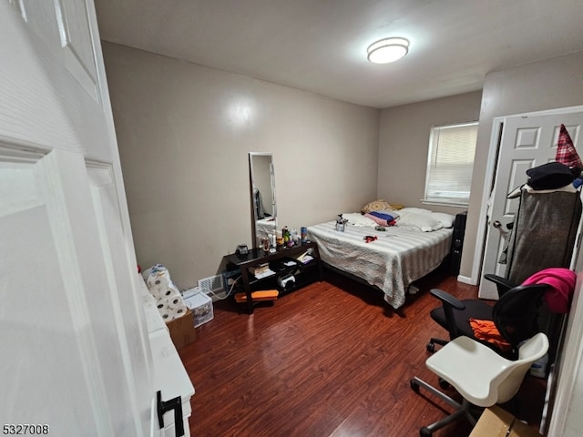 bedroom with hardwood / wood-style floors