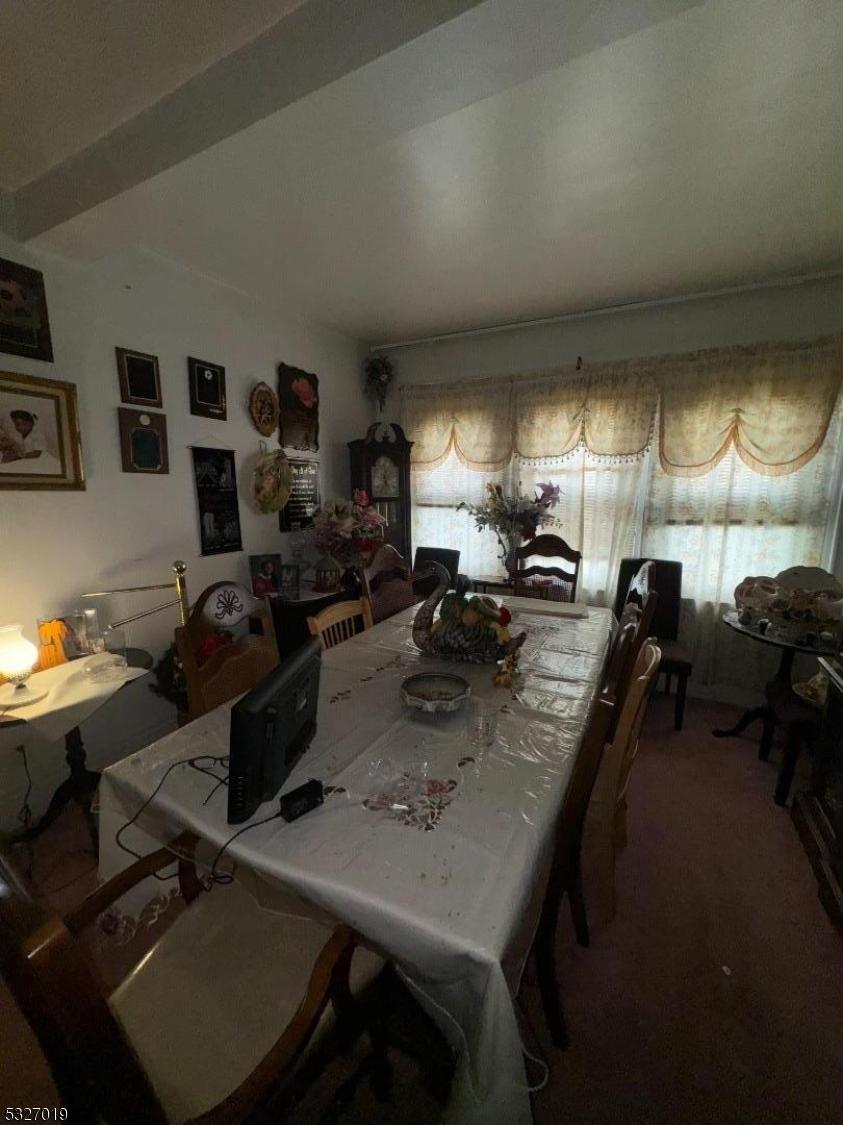 dining room featuring carpet flooring