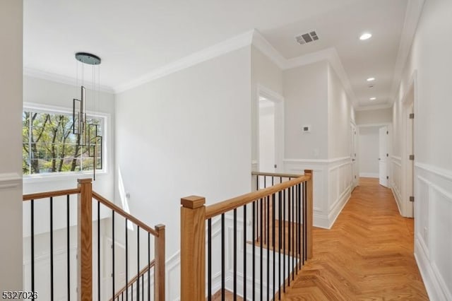 hall featuring crown molding and light parquet flooring