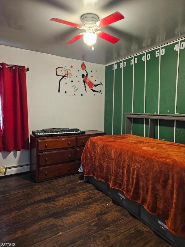 bedroom with ceiling fan, dark hardwood / wood-style flooring, and a baseboard radiator