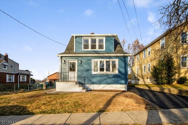 bungalow-style house with a front yard