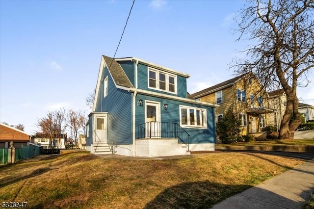 view of property featuring a front yard