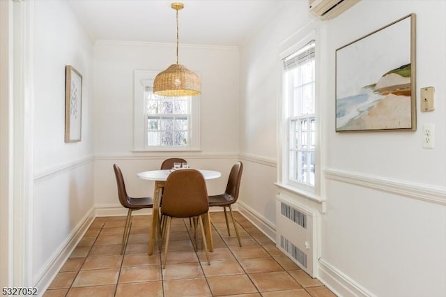 dining area featuring radiator, light tile patterned floors, and ornamental molding