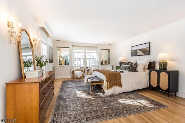 bedroom with hardwood / wood-style floors