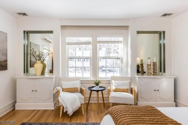 sitting room with hardwood / wood-style floors