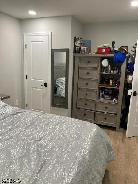 bedroom with light hardwood / wood-style flooring