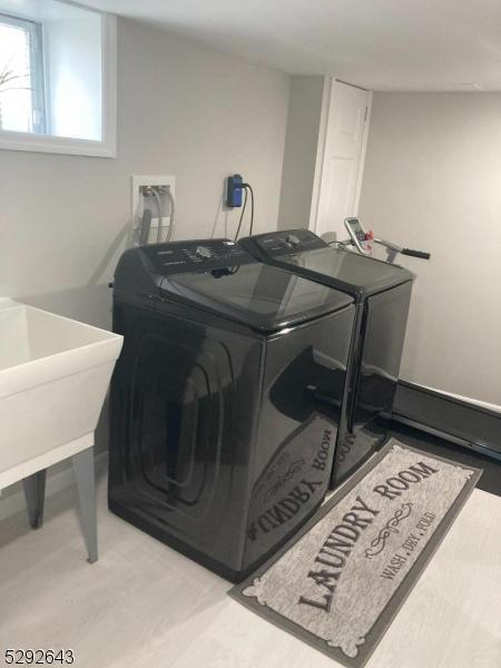 laundry room featuring washer and clothes dryer