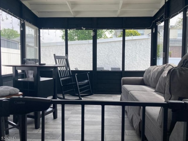 sunroom with beam ceiling and coffered ceiling