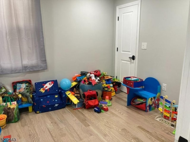 game room featuring hardwood / wood-style flooring